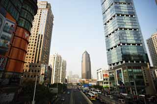 photo,material,free,landscape,picture,stock photo,Creative Commons,Row of houses along a city street of Shanghai, high-rise building, road, car, store