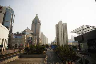 photo,material,free,landscape,picture,stock photo,Creative Commons,Row of houses along a city street of Shanghai, high-rise building, road, car, store